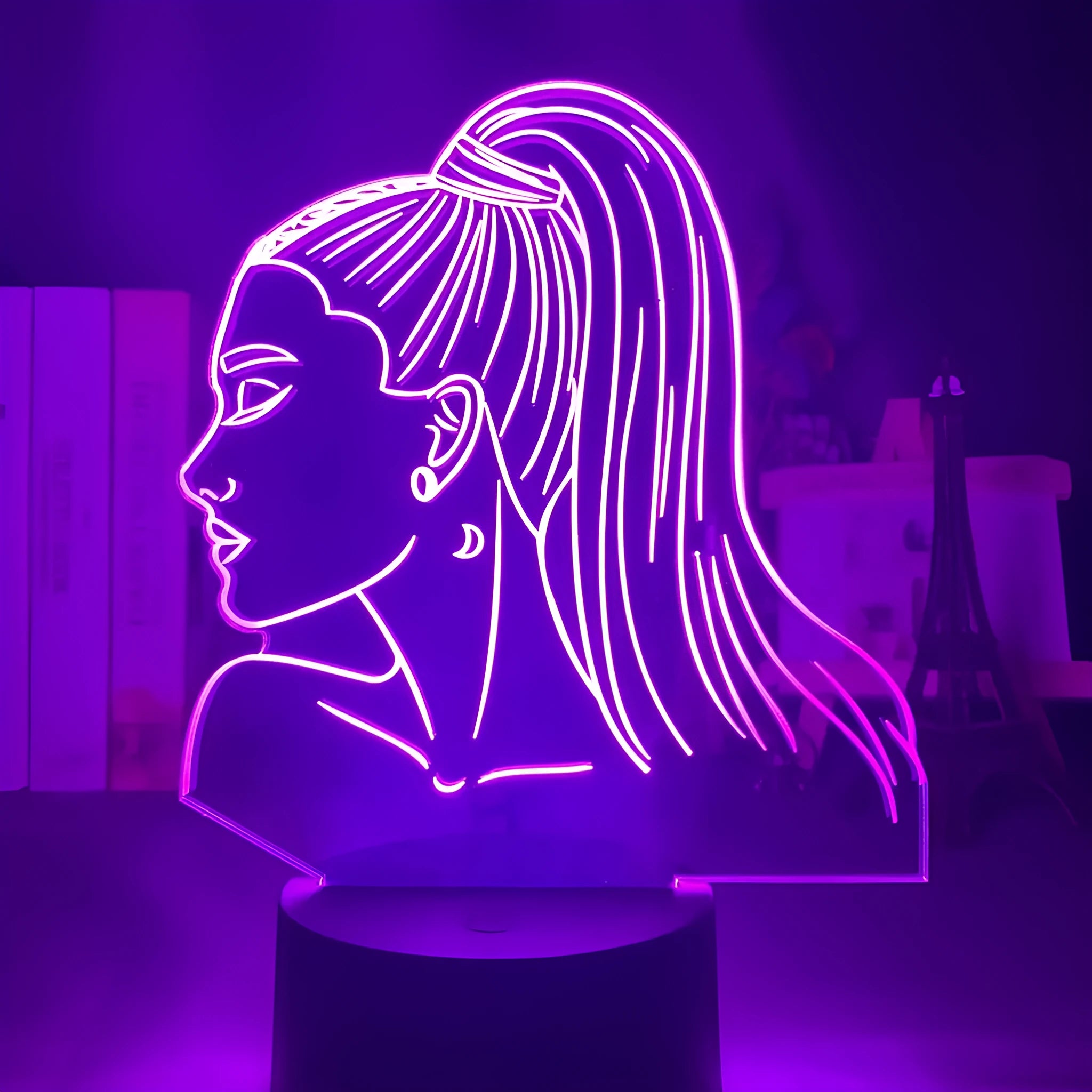 Slim European style acrylic 3D LED night light on a colourful black base, showing remote control.