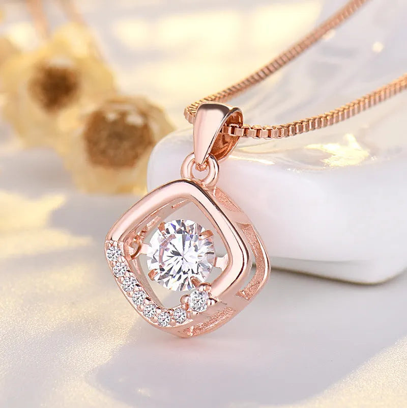 Silver love heart-shaped necklace with crown and bow charms in rose gold or silver finish