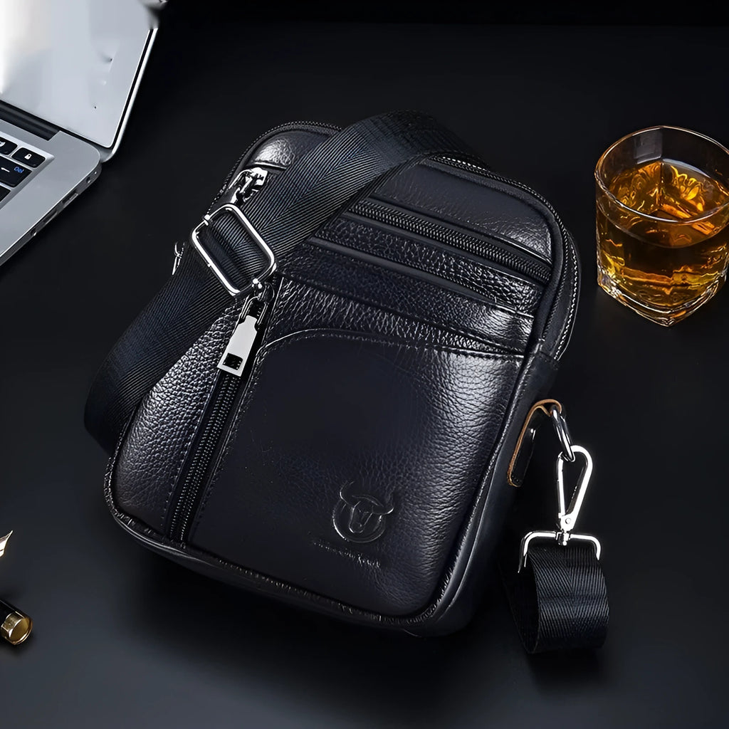Men's black genuine leather shoulder messenger bag with retro style on a plain background