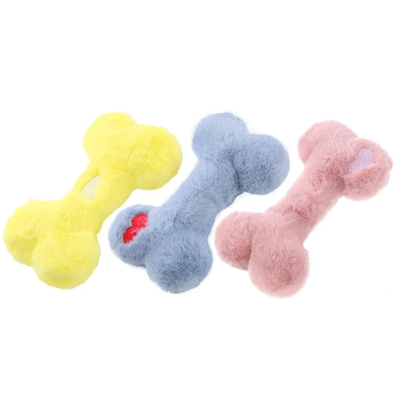 Blue pink and yellow plush bone dog toy with a textured grinding teeth surface.