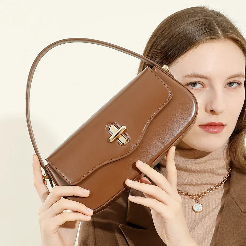 Genuine leather horizontal square baguette bag in black with lock detail