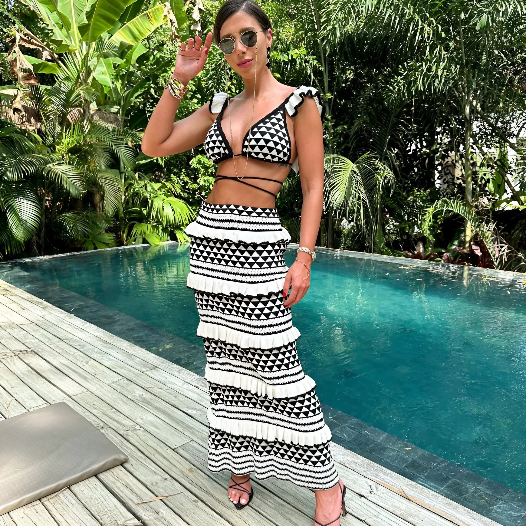 Black and white striped bikini set with ruffled spaghetti straps top and long knitted skirt for women