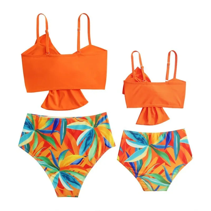 Women's big bow bikini print swim trunks set in orange, nylon fabric, matching top and bottom
