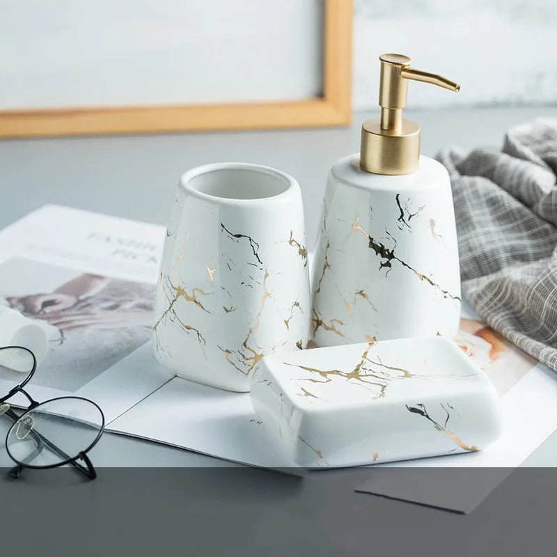 Ceramic bathroom wash set in white with decal finish, three pieces on countertop