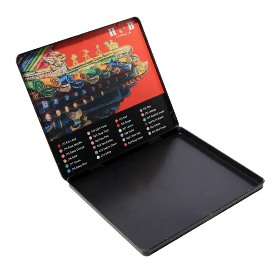 Metal tin box open to show 24 wooden water-soluble coloured pencils in assorted colours.