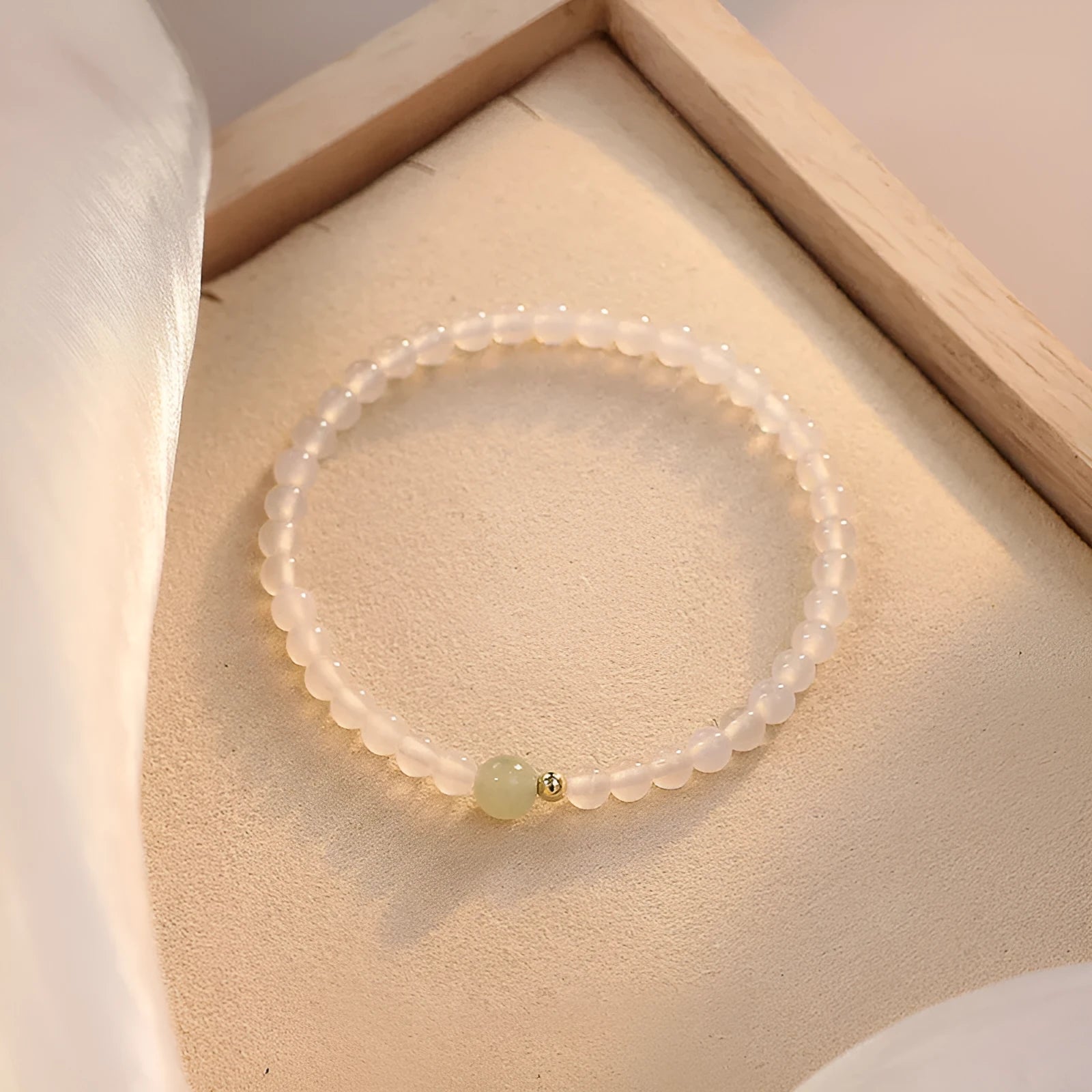 Natural Hetian Jade white agate women's bracelet 15cm on display showing banded white stones