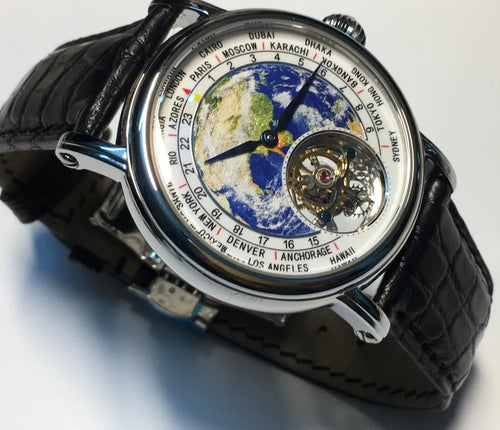 Silver 3D globe tourbillon mechanical watch with leather band and stainless steel case on white background