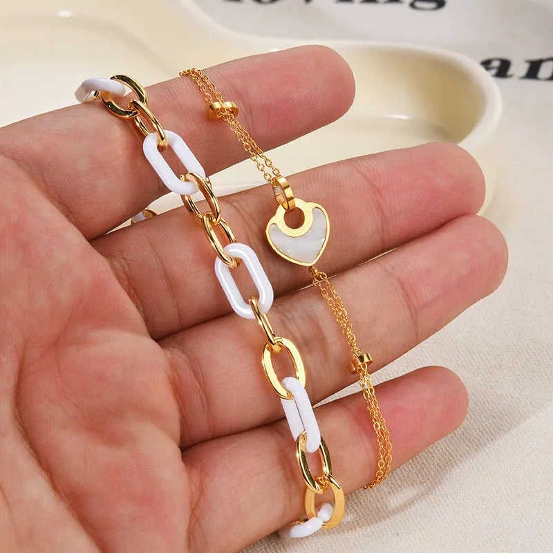 Women's stainless steel resin bracelet with double layered loving heart design in electroplated finish