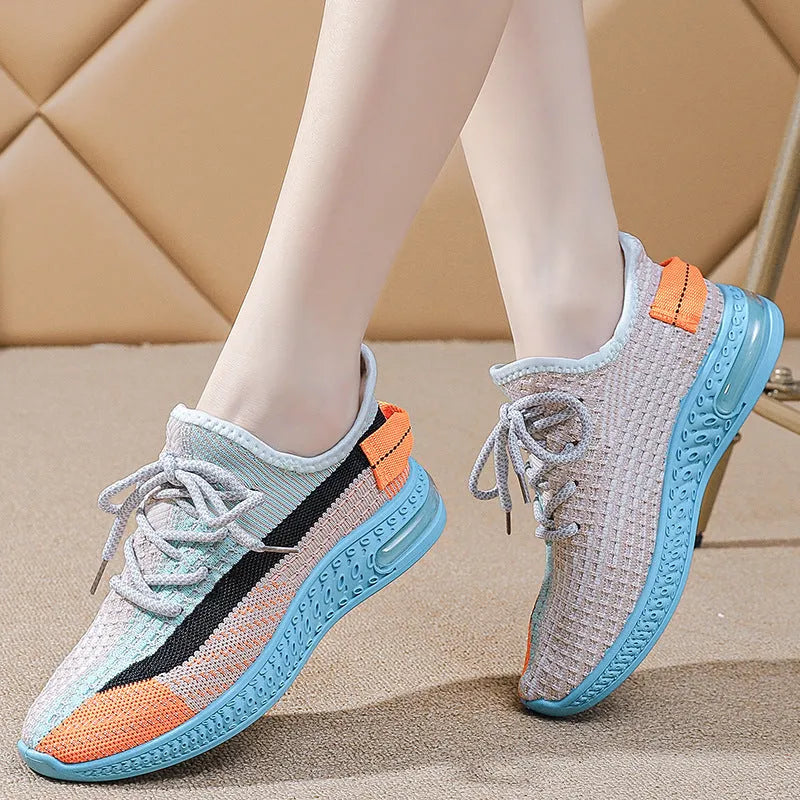 Women's lightweight breathable running shoes in purple, low-top lace-up design