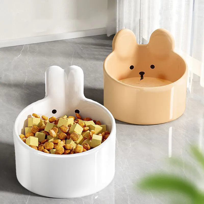White ceramic pet food bowl with slant design on a plain surface