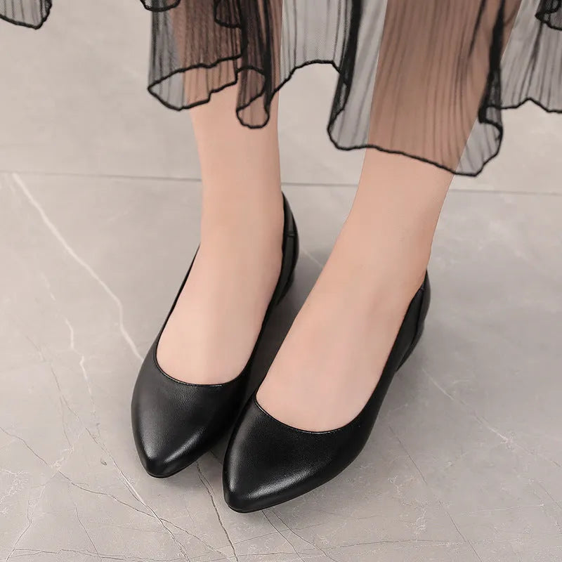 Beige flat pointed low-cut cowhide leather shoes with buckle closure and low heel on a white background