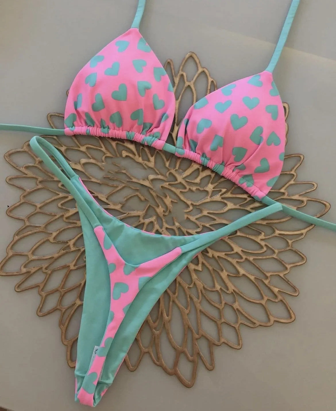 Backless one-piece swimsuit with a heart print and split side detail