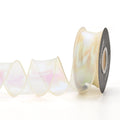 Fishtail yarn mesh ribbon roll in various illusion colours showing wave pattern and 4cm width