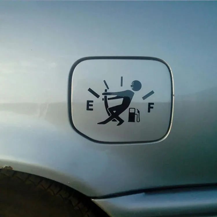 Reflective insufficient fuel car sticker 12.7cm x 9cm in black on a car dashboard