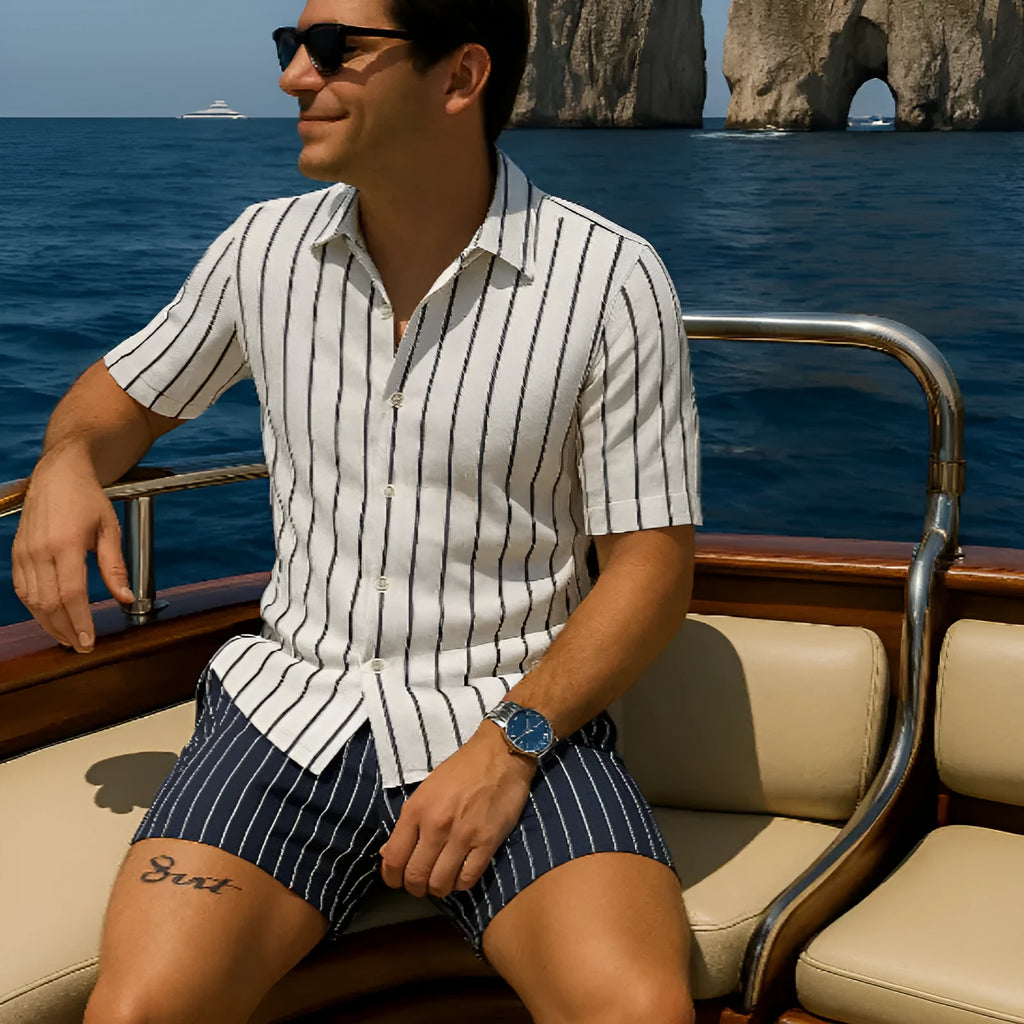 Man wearing a light mature casual beach shirt and shorts set made from four-sided elastic fabric.