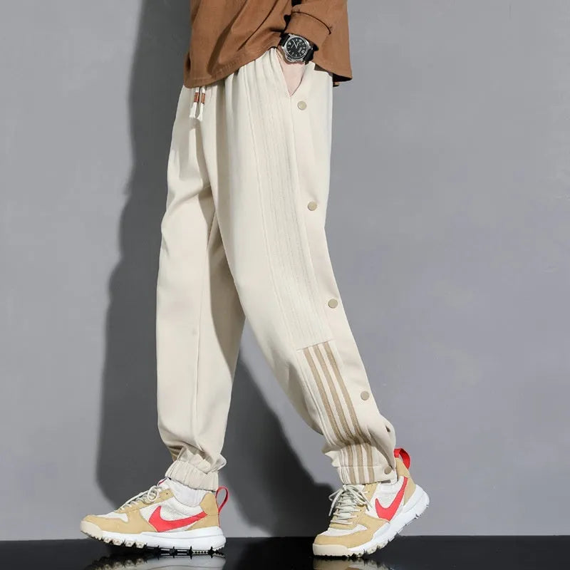 Men's loose grey ankle-tied sports sweatpants with drawstring waist