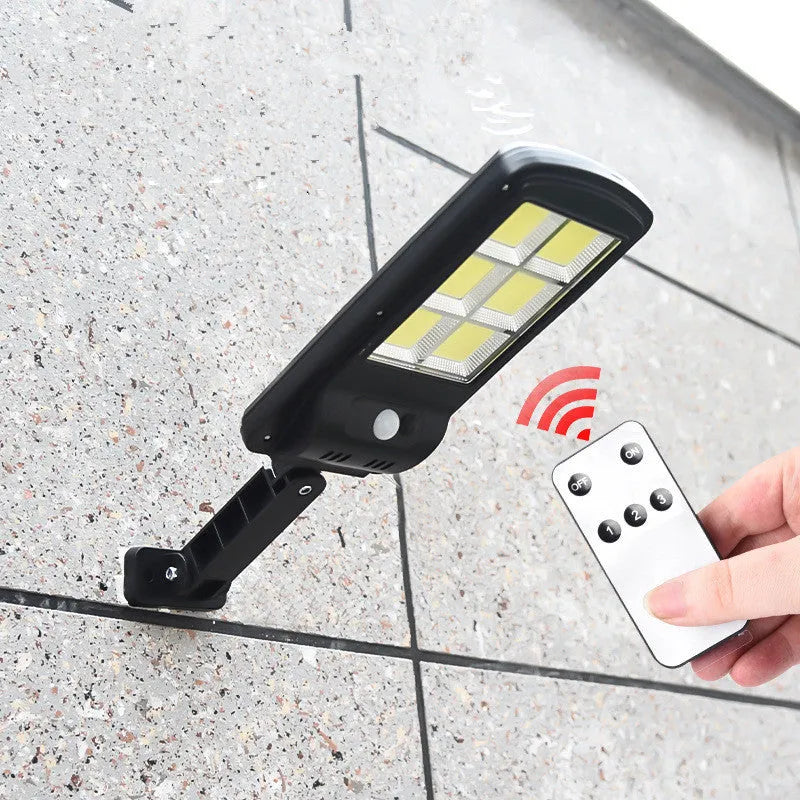 Black solar powered outdoor light with motion sensor and IP65 waterproof rating