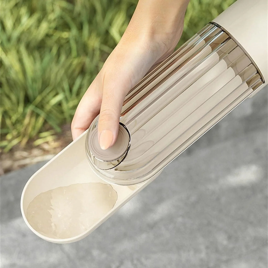 Beige foldable dog water bottle and food dispenser with leak-proof design for outdoor use