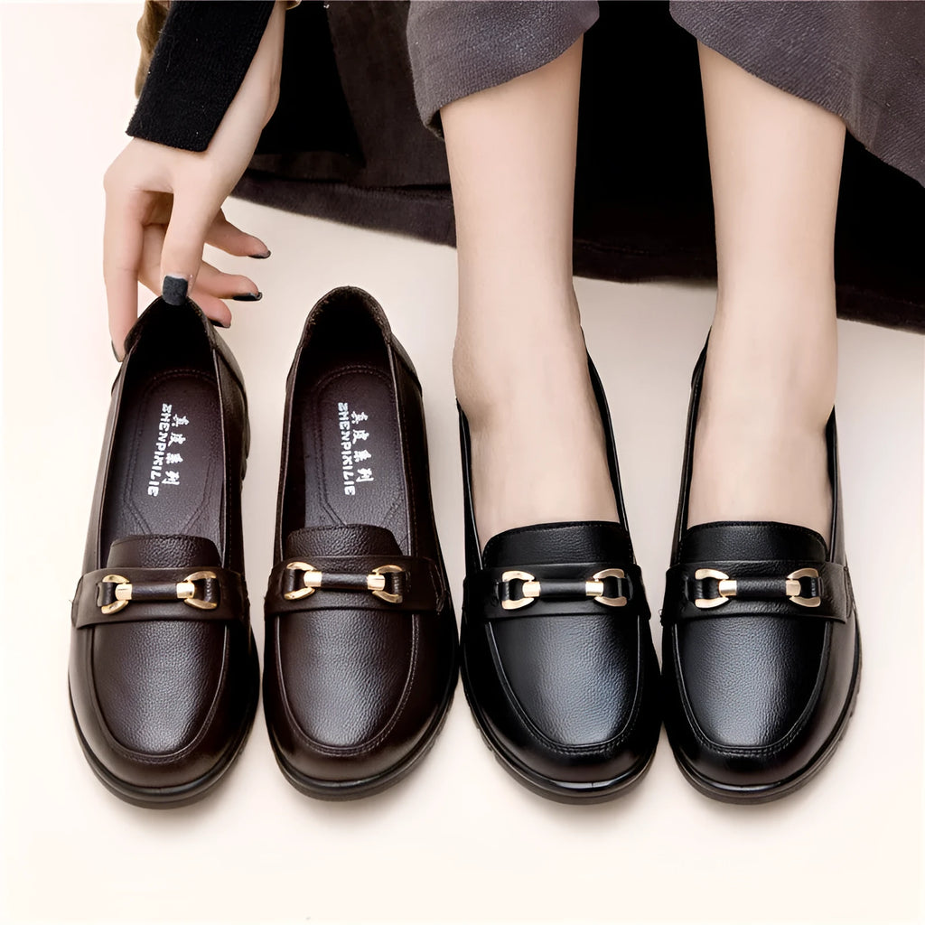 Black women's casual leather pumps with a round toe and low flat heel