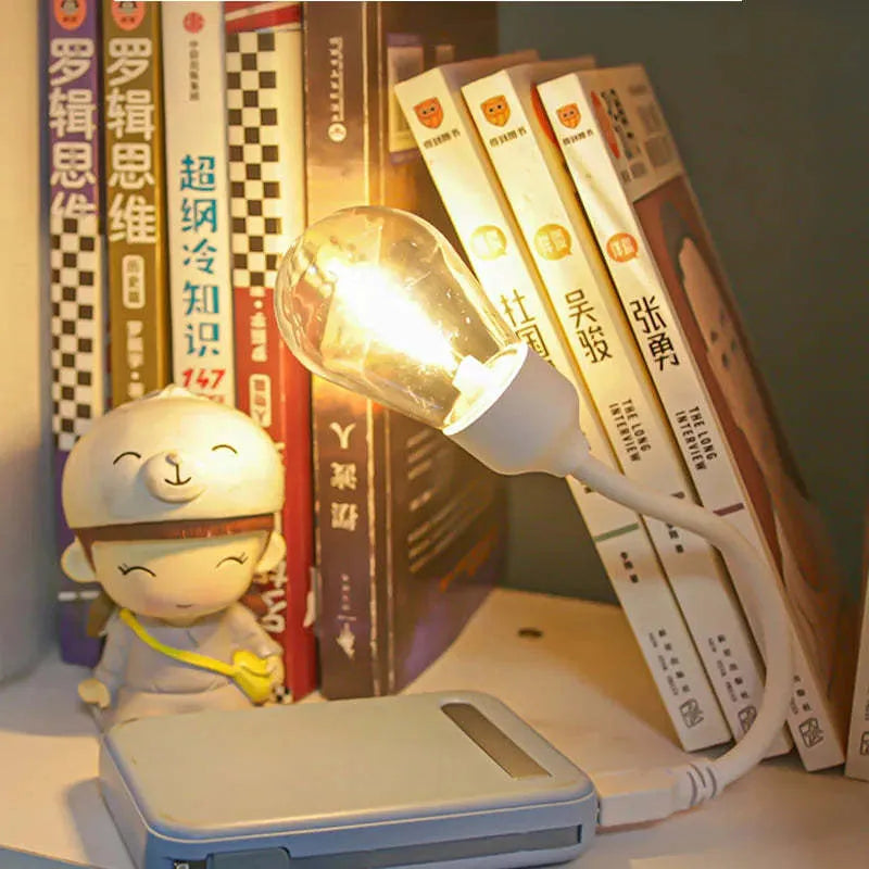 USB rechargeable folding night light with warm white tungsten bulb, shown in open and closed positions.