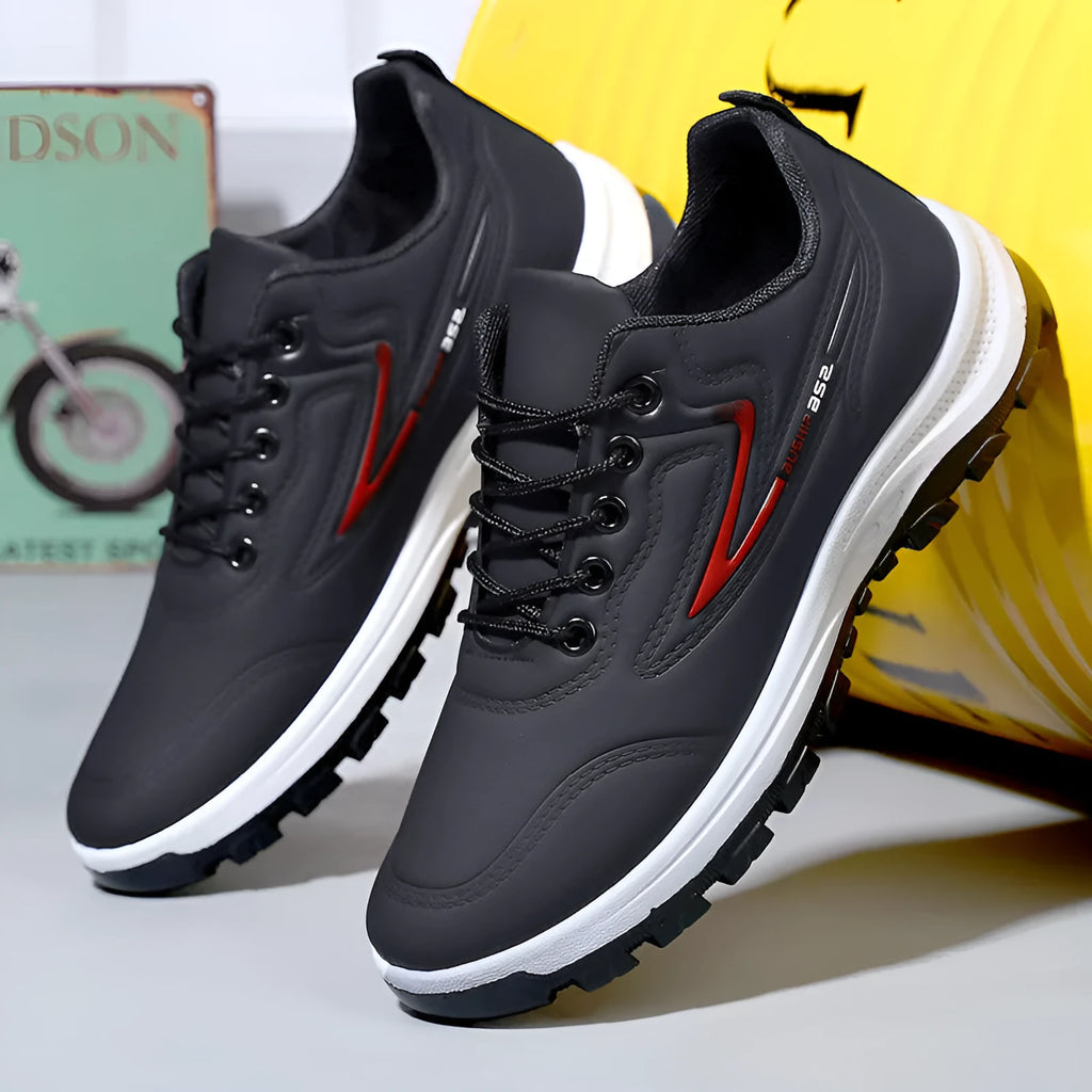 Waterproof leisure soft bottom sports work shoes in black and gray, low top, lace-up front, artificial PU upper