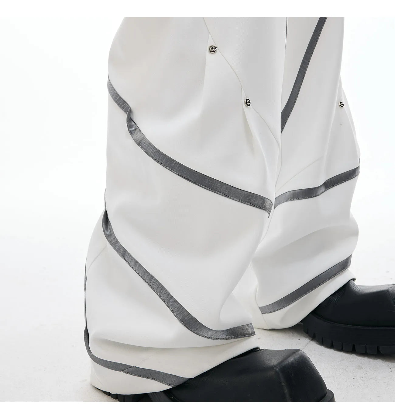 Men's polyester trousers with three-dimensional cutting and metal rivet pleated detailing