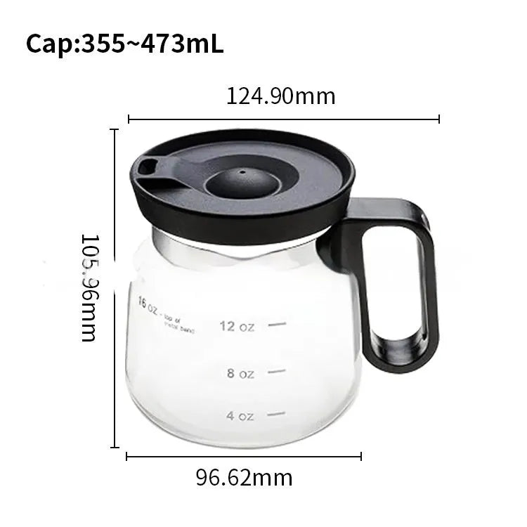 Transparent borosilicate glass coffee maker with black silicone thermal cover on a kitchen counter.