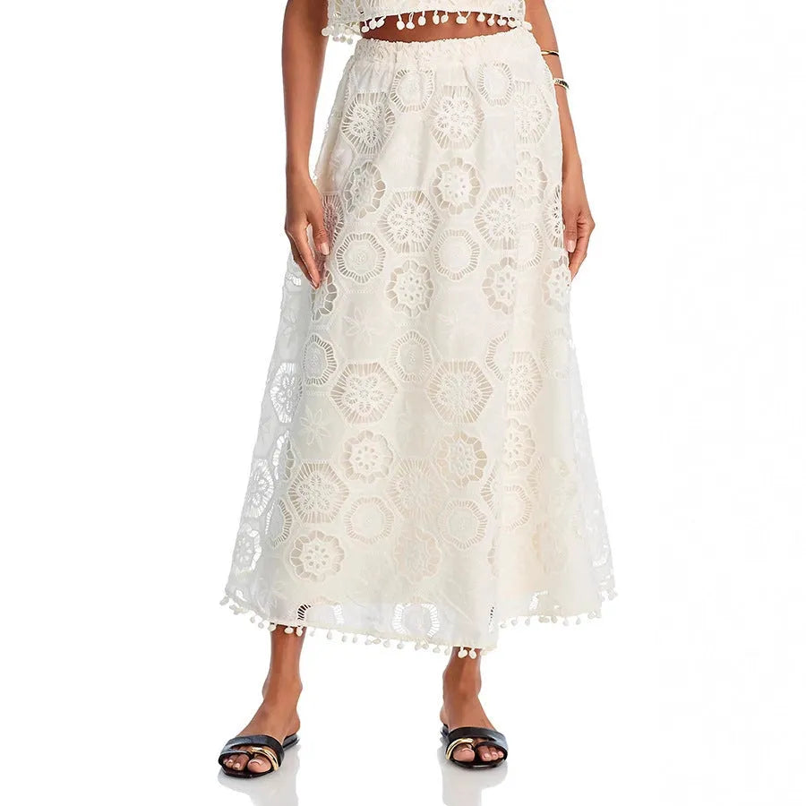 White women's sleeveless suit top with matching embroidered long skirt set