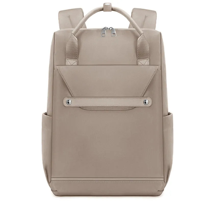 Lightweight large capacity schoolbag in solid colour waterproof nylon, unisex design for school or travel