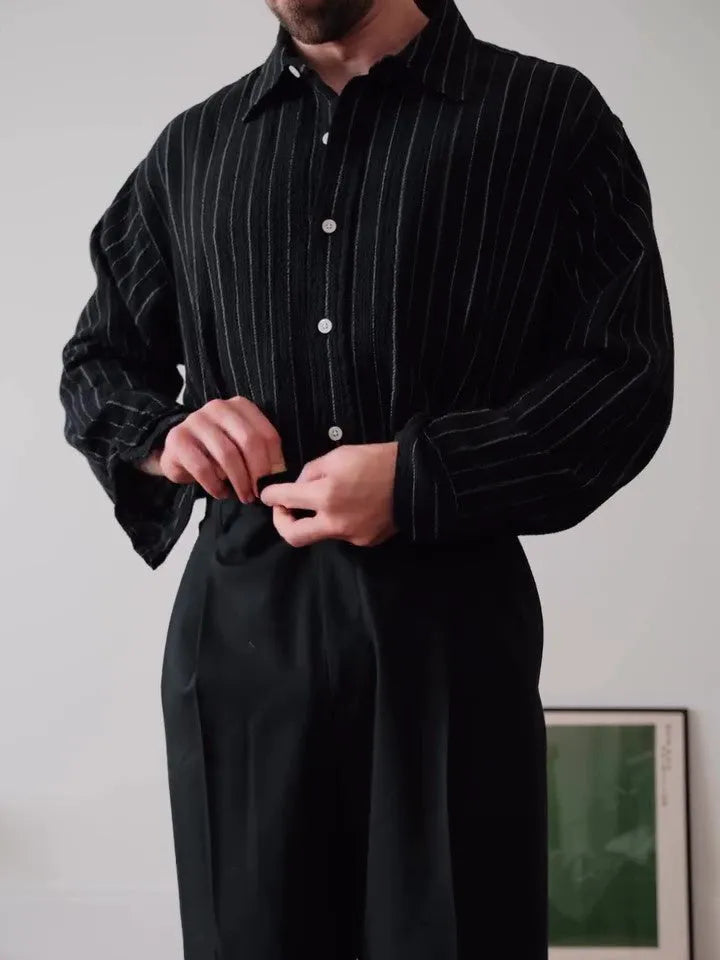 Black pinstriped button-down shirt with regular fit and striped pattern on polyester fabric