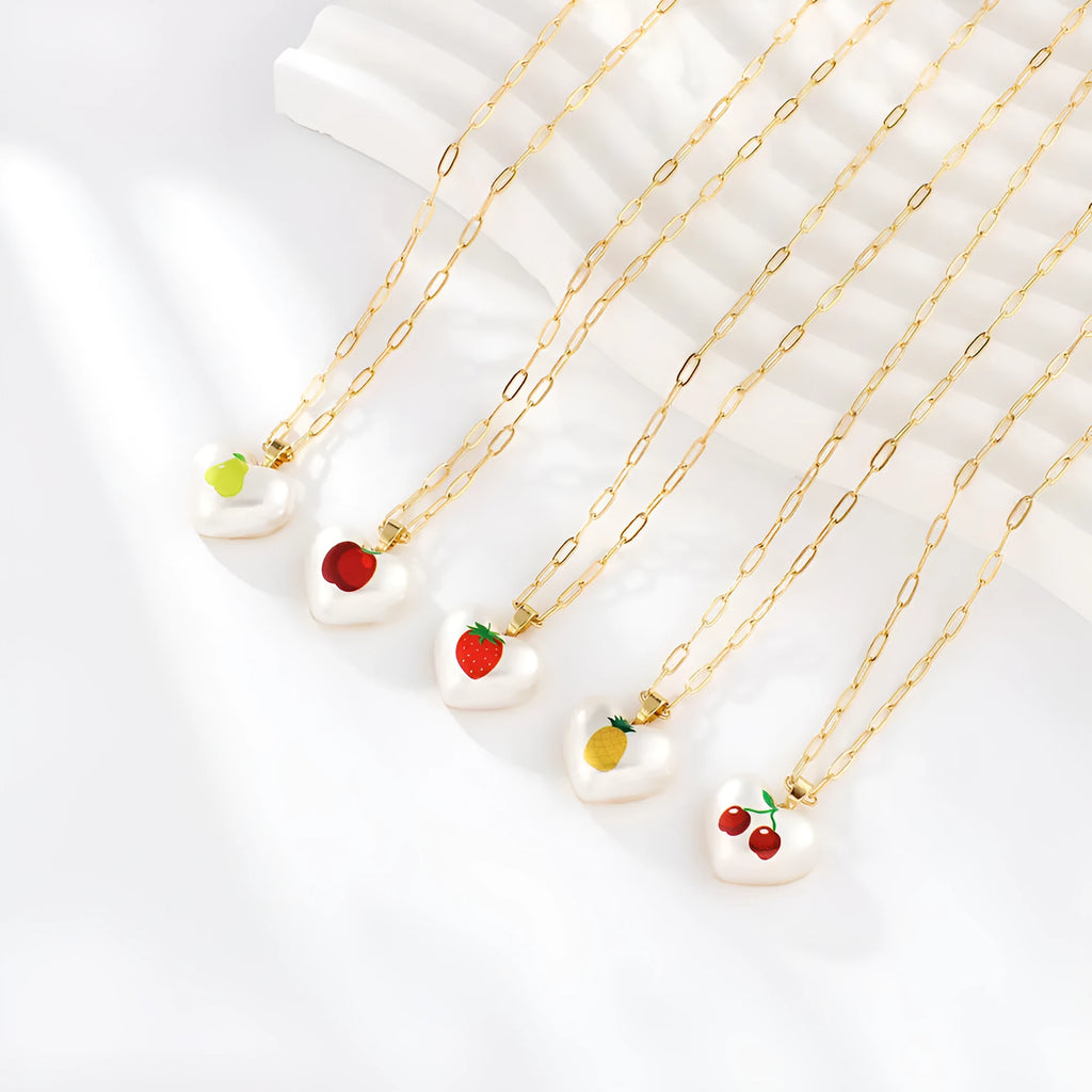 Heart-shaped fruit pendant necklace with strawberry design on adjustable metal chain