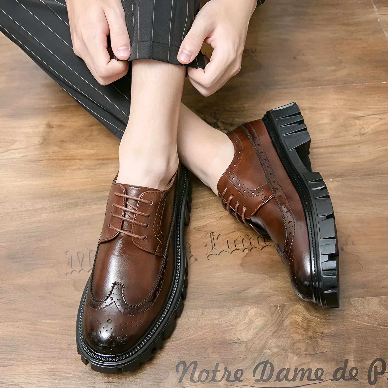 Men's classic black and brown brogue Oxford shoes with round toe and perforated detailing for formal business wear.