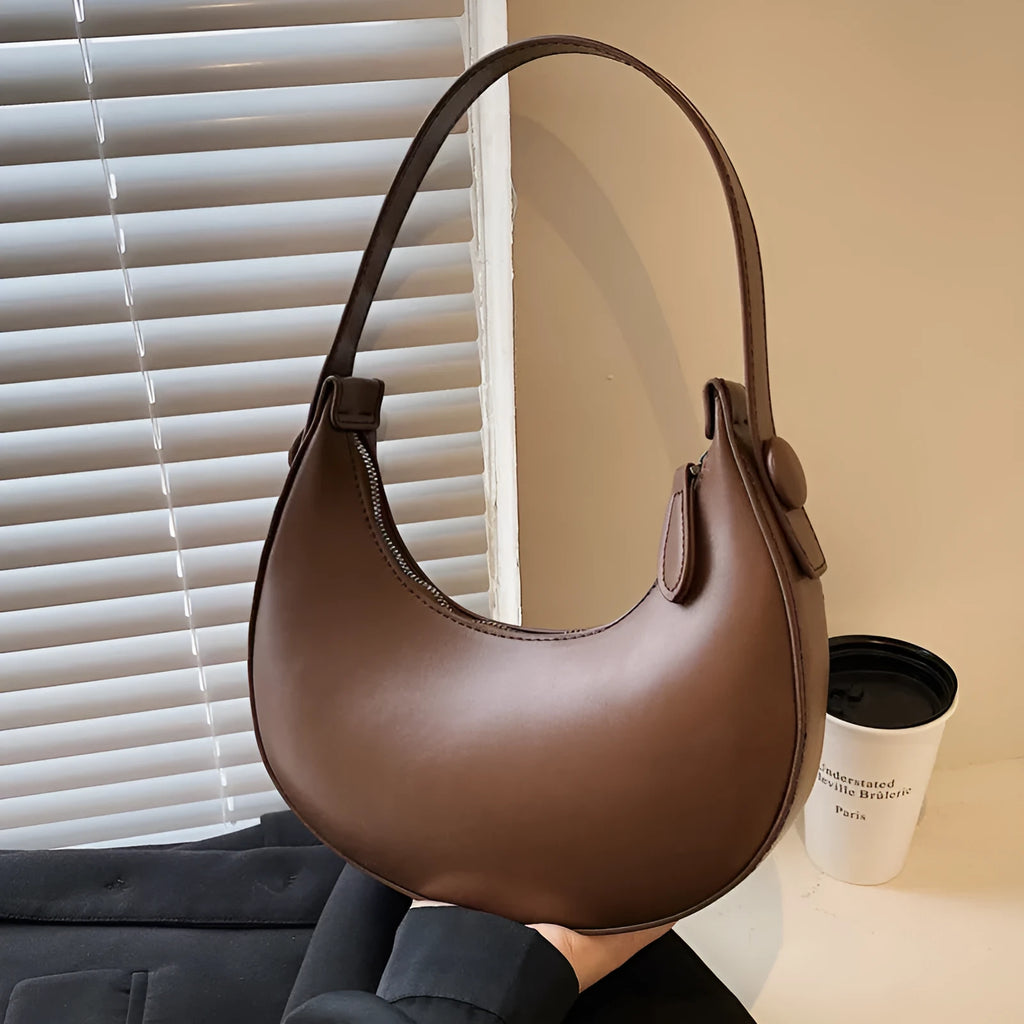 Retro dumpling-shaped women's PU leather shoulder bag in black with sandwich pockets