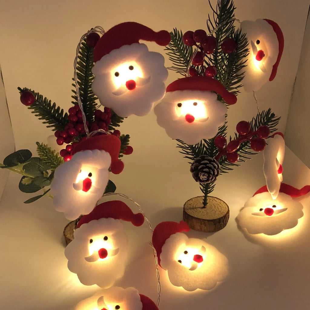 Snowman LED string lights garland with warm white glow on a Christmas tree
