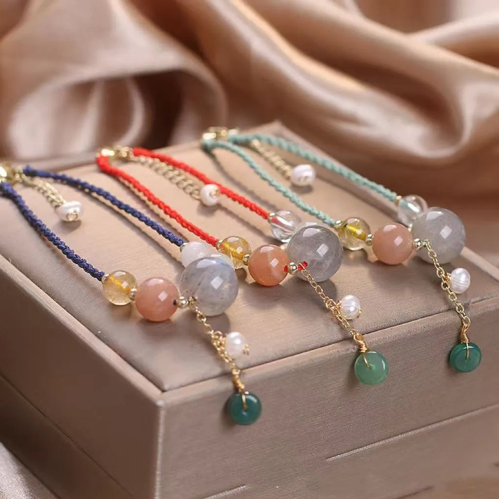 Hand-woven peace buckle bracelet with crystal and sequin details in red, green, and blue colour options for women