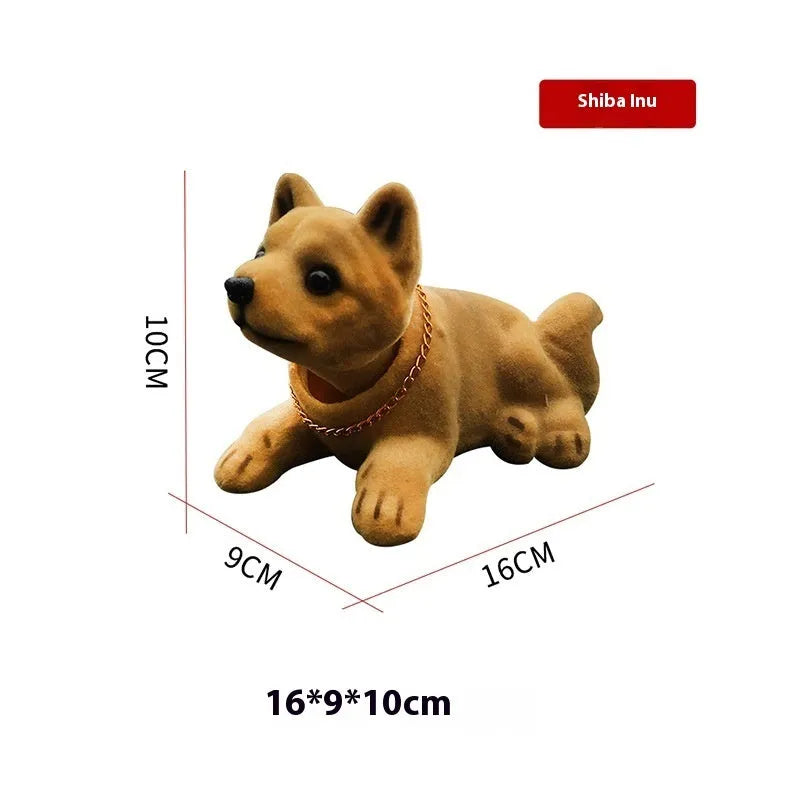 Resin head-shaking dog car decoration in multiple breed colour options on a car dashboard