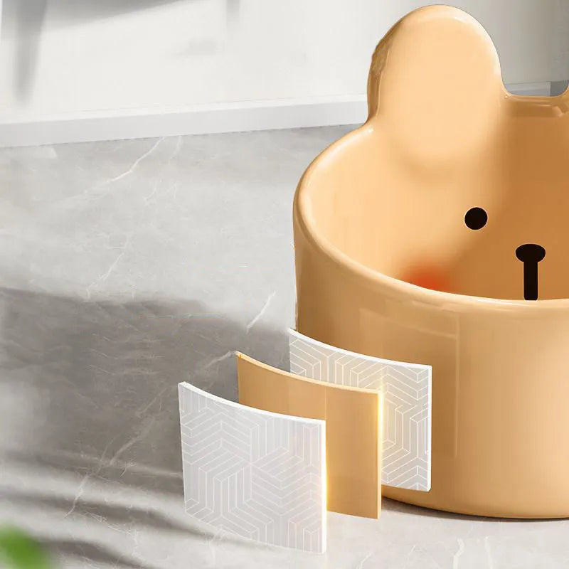 White ceramic pet food bowl with slant design on a plain surface