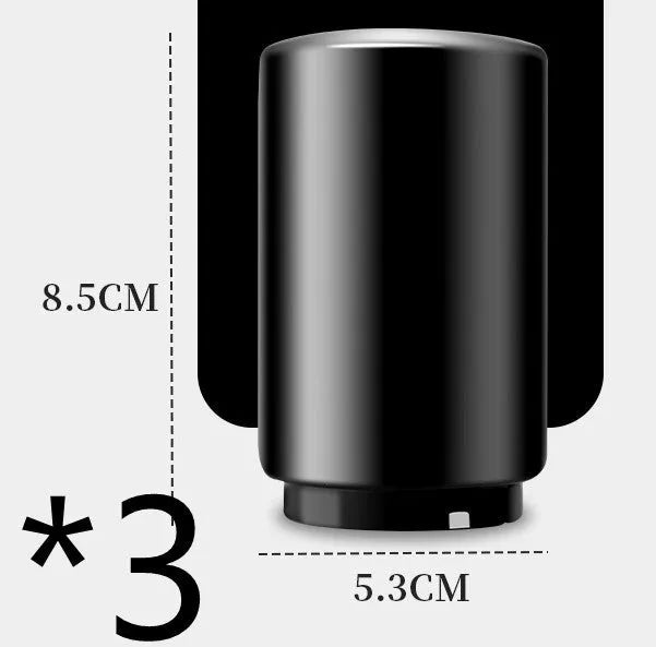 Automatic stainless steel beer bottle opener with magnetic cap catch on a table