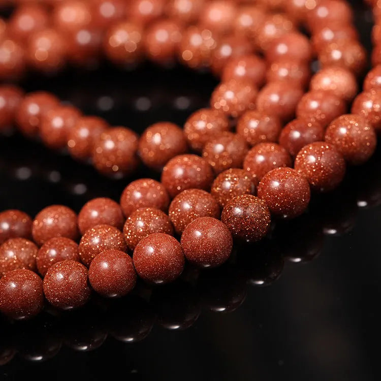 Golden star stone and nugget sand multi-circle bracelet with fu character on a retro-style chain.