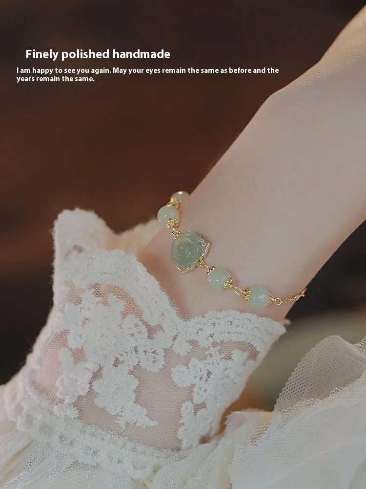 Women's bracelet with Hetian jade rose flower design and 14K gilded construction