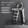 Adjustable electronic counter spring grip in orange colour with digital display.