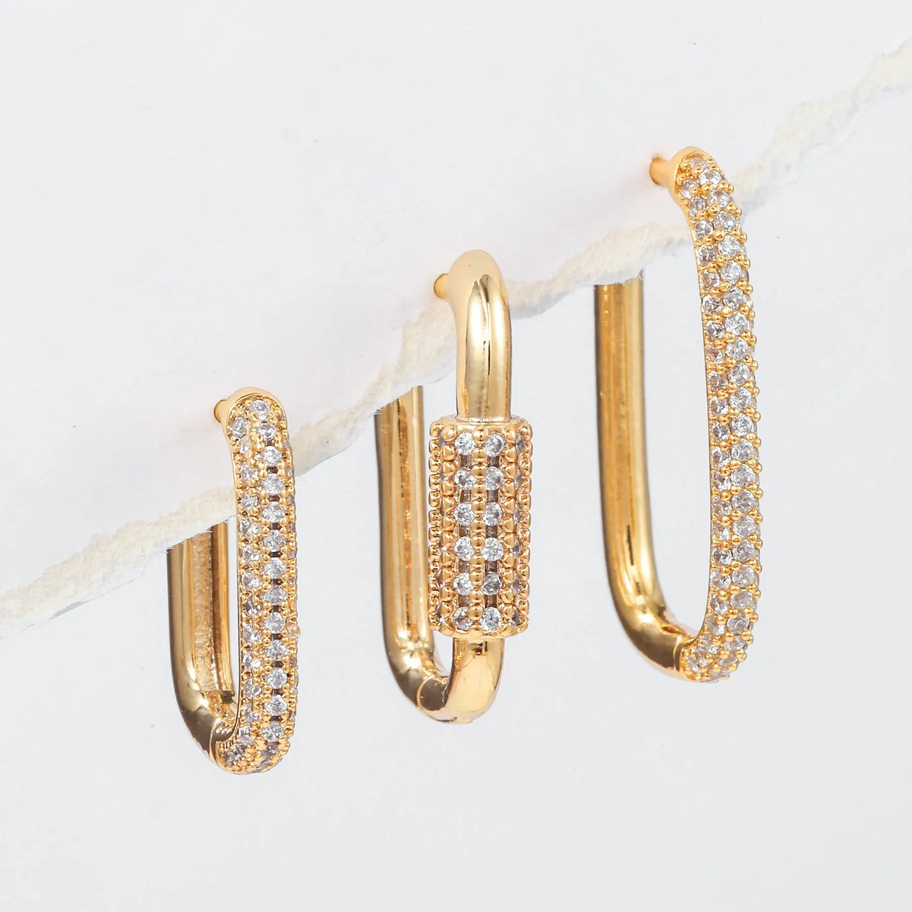 Geometric three-piece ear clip set with micro inlaid zircon detailing on copper in gold and white colour options