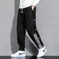 Men's loose grey ankle-tied sports sweatpants with drawstring waist