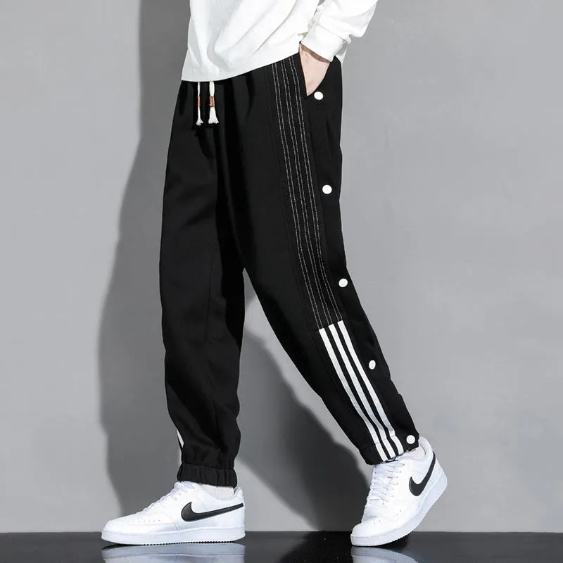 Men's loose grey ankle-tied sports sweatpants with drawstring waist