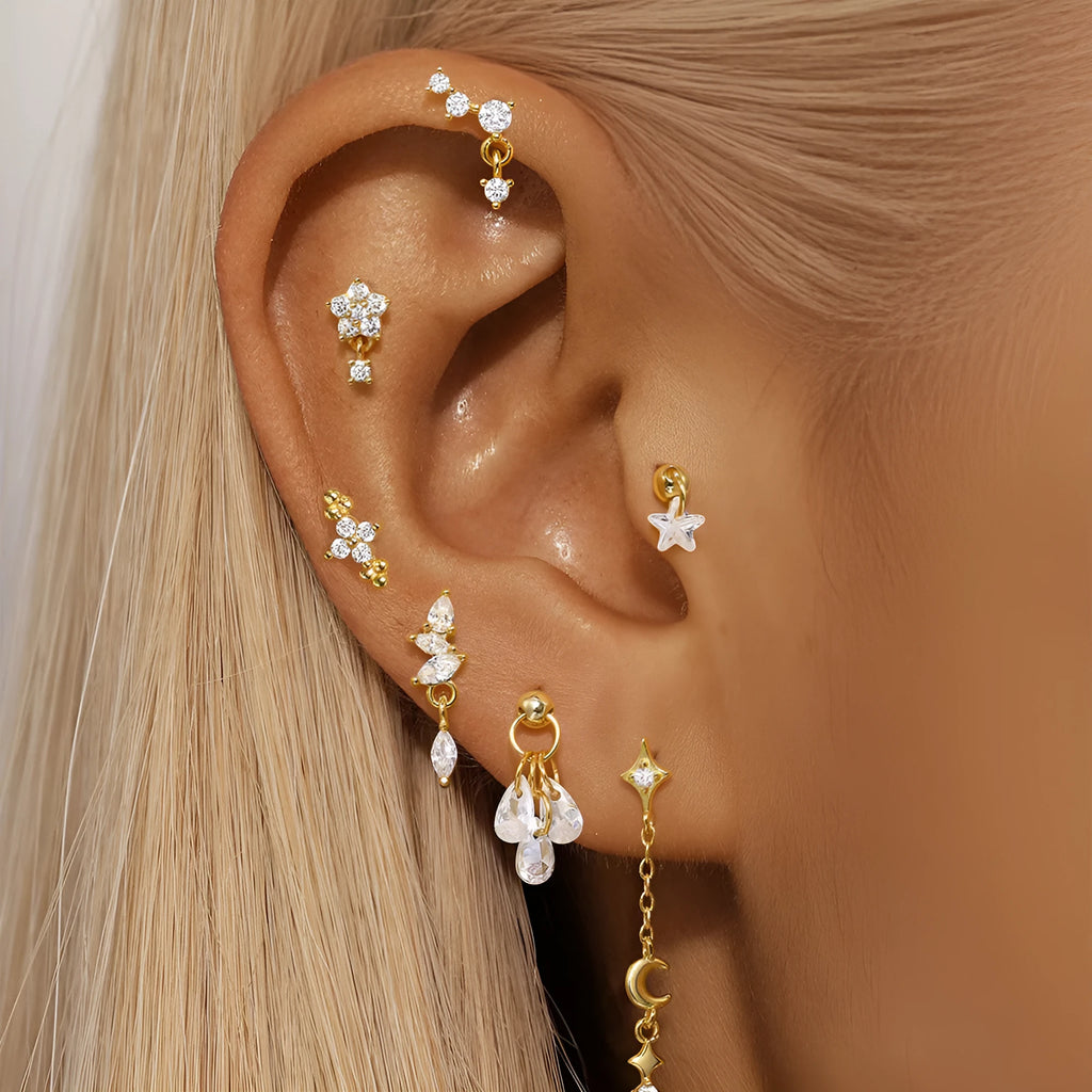 S925 sterling silver geometric moon and star earrings with diamond accents in a gold colour.