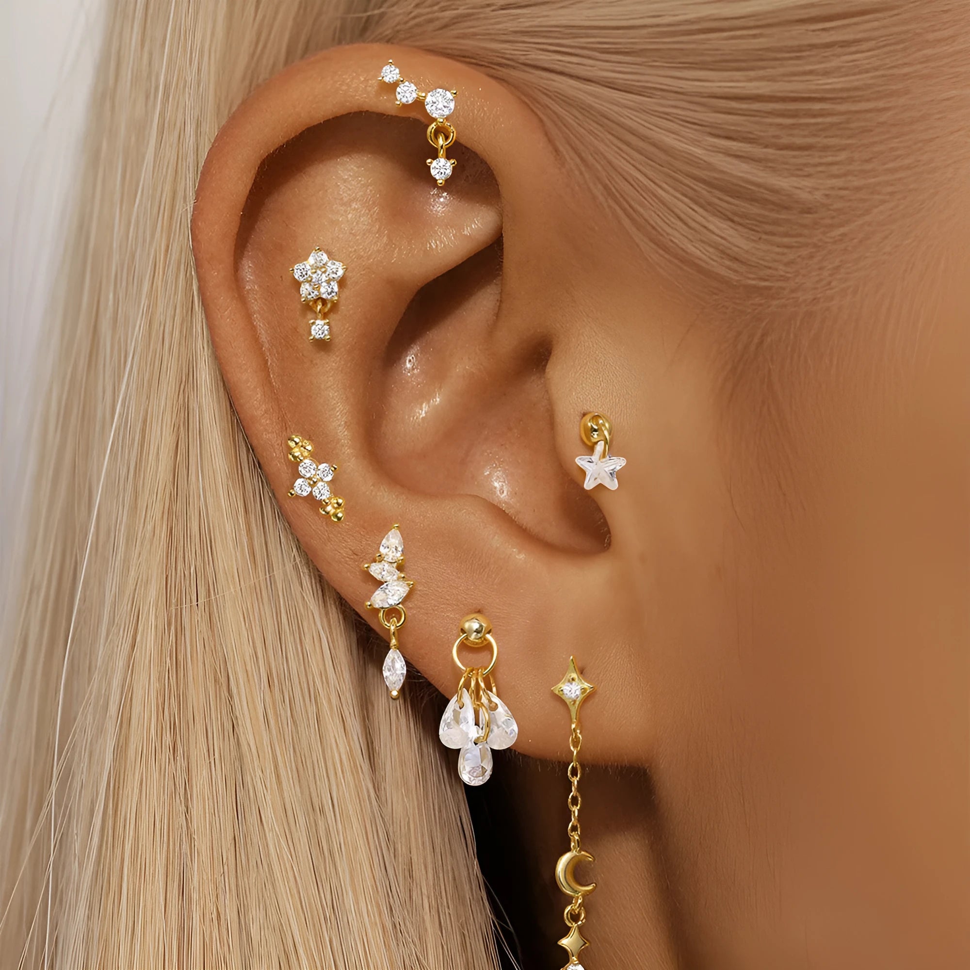S925 sterling silver geometric moon and star earrings with diamond accents in a gold colour.