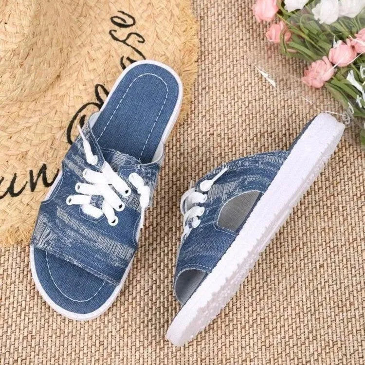 Blue women's canvas slippers in Roman style with a flat design and rubber sole