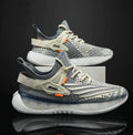 Men's white woven mesh platform sneaker with a flat rubber sole and round toe on a grey background.
