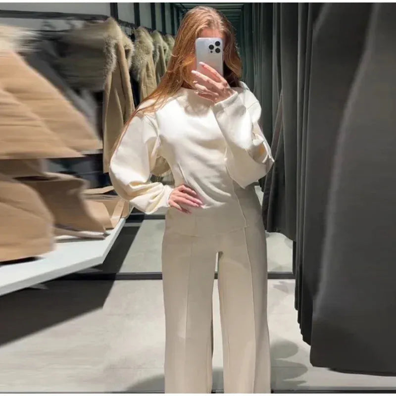 Women's polar fleece suit set showing long sleeve O-neck top with wide leg trousers in multiple colour options