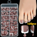 Box of 120 French white edge nude square short toe nail pieces in nine shades.